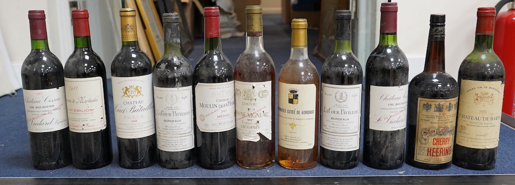 Eleven bottles of wine: Chateau Moulin Hargue 2003 x1, Chateaux Cissac 1982x2, Chateau la Coer Pavillion 1981 x2, Chateaux de barbe 1976 x1, Chateaux Haut Batailly 1998 x1, Premier Cotes de Bordeaux NV x1, Domain de Mart